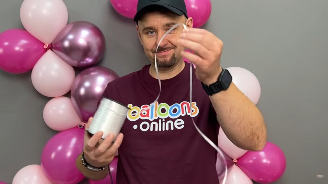 Step 1 - Cut off enough line and inflate your balloons